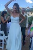 My wedding dress was absolutely perfect for our backyard wedding two weeks ago. It was gorgeous, yet not too much. I had a seamstress hem the front a little bit (it was a little too long) and add a small blingy belt which made the dress pop. Everyone raved about how beautiful I looked and how gorgeous my dress was. To be able to order a dress online (the only one I even tried on) and have it fit so perfectly was amazing!! I'm so, so happy with Lulus!!!
p.s. these pix aren't the greatest, just from family as we don't have photographer pix yet. - Barbara B.