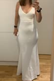 It fits like a glove, but if your belly sticks out it will be super visible. I didn't like the straps, they look bit cheap - Agata T.