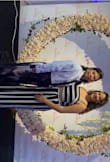 Very cute & comfortable material. I did have to hem the ends of the pants because they were too long (even with 3.75 inch heels). When I did wash it the navy blue blended with the white so the white stripes turned into a light blue. - Edel S.