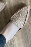Still love them, but the front is a tiny bit wider than expected. The sparkles stay on very well and make any outfit fancier. - Keira H.