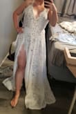 Bought this for my destination wedding May 2022. So impressed with how it fits, and the quality of material. Its not a thin flowy material, its got some weight to it. I am short so it will be getting hemmed but I love it overall! The leg slit goes all the way up to the goods, but still feels classy. The under lining one piece doesn't bunch up so you have a smooth look! - Jordan G.