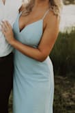 I sized up and got an XL because I was taking my engagement photos and didn't want it to be too busty. I would say it was true to size. It fit perfectly up top but was large around the waist area so I had it altered and it fit beautifully! - Katie S.