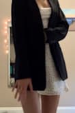 It has a liner so I don't have to wear a bra. It's a true white, I thought it would be a little bit more of a cream color based on the pictures- but I still love it as is. I wore it to homecoming with a blazer. - Sabine H.