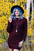 It was a little shorter than I expected but I sized down based on reviews so maybe that was the problem but it would have been way to large on the top for me if I'd bought a small.  I think it's more flattering on larger chested women but I still love it! Wore it for a photo shoot but will be wearing it all winter with jeans and leggings. It seems like it will be super warm and the color is beautiful! Would definitely buy again! - Alyssa M.