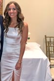 I bought this dress for my rehearsal dinner and was absolutely obsessed! It fits true to size, the slit is just the right length and the material is actually a little thick which I loved. It wasn't just like a silky slip material but actually has some stretch to it. Got so many compliments and will find a way to wear this again! - Michaela B.