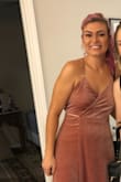 The material is nice, heavy and very pretty! I'm not very busty so I pinned it on the sides where it didn't fit me as well. It was long on me as a 5'9" lady in heels. I probably could have ordered a small instead of a medium. But easy to move in,  a gorgeous color. - Christina B.