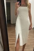 I feel like the photo isn't an accurate depiction of the fabric. It was HUGE on me and I had to have it altered. Also, it wrinkles incredibly easily. I had a 12 minute drive and the back was very wrinkled when I arrived at my event. - Steph S.