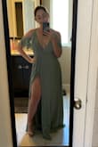I will join the chorus of saying this dress is amazing but also LONG AF. I had to get it altered and it actually cost more than the dress to get it hemmed and add a little clasp so my girls weren't hanging out. The first photo is before alterations, and the second is with. Overall, I LOVE this dress... but be prepared to drop some coin getting it altered if you're a little on the shorter side. ALSO- not to be worn on a windy day... that slit goes all the way up and you will be showing all the goods if a breeze catches you off guard. - Ariel M.