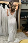 The silhouette of this dress was amazing! I loved the diagonal lace--super unique and flattering! I think the string in the back doesn't add much so if I go with this dress, I will remove it. I ordered an XS and it fit like a glove! Loved it, great price!!!! - Chelsea C.
