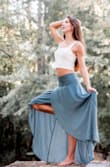 The high-low maxi skirt is made of a light-weight material that is easy to iron and beautiful to twirl! The sage green is a beautiful accent color for pictures and adds a classy yet earthy feel. Pictures courtesy of Lorinda West Photography. - Tricia M.