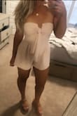 This romper is really flattering and definitely on the shorter side so it's perfect for going out! I would say it's true to size on the shorter side but the nice thing if you do size up is that the bust can be tied tighter to create a more fitted look. - Amanda F.