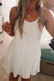 I love this simple and boho white dress! Be cautioned it does shrink after washing but other than that it is a really perfect little dress! I love that you can adjust the straps! - Amanda F.