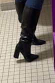 I've got big calves but I managed to get these on even with jeans underneath(!) the heel is comfortable to wear the entire day through work and I got sooooo many compliments. the picture here is a little blurry, the crocodile pattern is perfect though (i'm 5'10 and the top of the boot is like 2.5 inches below my knee cap) - Delaney C.