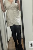 Bought it for my bachelorette party, it was cute and did the job for the occasion. The sequins were shedding once I took it out of the box so I think it's a little overpriced for what it is but the style was flattering and the sleeves were great for this time of year! I'm really short and it was short on me. I didn't want to wear tights but had to so be aware of that. I bought a XL and it was a little snug but fit, didn't have a size bigger. - Melanie S.