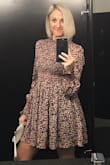 Perfect fit. Shirred top detail accentuates waist. High collar is classy. The shorter length adds a flirty factor. I received many compliments. - Lacey B.
