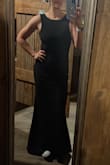 Wore this in a wedding as a bridesmaid and it was a hit. Business in the front, party in the back. Hugs you in and the material is awesome. Did have to get it hemmed but par for course with my height. Hope I can find a reason to wear it again. - Anya K.