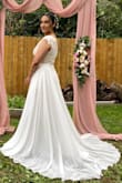 Get it a size up! Other than that beautiful. Great quality. Everyone loved my dress - Nicole S.