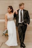 I honestly fell in love with this dress before I was even engaged. It seemed exactly what I would be looking for. I am very short and didn't wear heels, so I did have the hem brought in. I left the train it's original length to give it a little extra. I received so many compliments. The quality of the dress was amazing. The top did not rub or irritate my arms at all. It was really just perfect. - Rachel R.