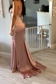 Runs a little large, usually a size 4 but ordered a 2. Had to get dress hemmed because I am short. It's a beautiful dress, stretchy material and very comfortable! Wore to a wedding. Would definitely recommend. - Isel H.