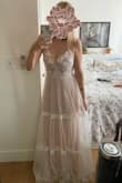 This dress is a dream in person. The materials, if made cheaply, could come across as costume-y but no, I'm always impressed with Lulus' quality for the price-point. The dress is beautiful.
I'm doing a very small backyard wedding and didn't want to spend a boat load of money on a wedding dress. I had kind of a picture of what I wanted for my dress, but based on the customer reviews for this dress got kind of excited and decided to try it and yeah, just loved it. I did read another review that said they wore a trumpet slip underneath, and I think I will do that too, as you can see the slip of the dress hugs the legs underneath. - Katina