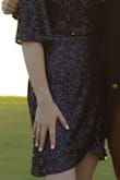 This dress was gorgeous, comfortable, and just a tiny bit unusual. My daughter got lots of compliments on it at homecoming. It was longer than it looks in the photo on the model, well past her fingertips. - Melanie R.