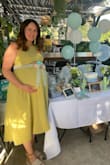 Wore this dress to my surprise baby shower. The green isn't the same color as the one the model is wearing, but I still loved it. Loved the pockets on the dress! The material was great quality, not thin at all. Got so many compliments on this dress. - Erika R.