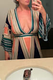 Fits well overall but the v neck plunge is very deep and exposed! If you want something that covers a bit more, I wouldn't get this design. I had to send it to a seamstress to close it a bit. - Mariel B.