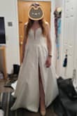 I had been looking at many stores for my dress and couldn't decide on a style or type. I searched online everywhere but being on a budget meant I didn't have many options. But I saw this and knew quickly I had to try it. I am so glad I did because it's exactly what I wanted and more! It's not too heavy so the dress feels more like apart of me than dragging me down. It's long so I will need to hem it but it's much better than being short! I ordered an 8 and it zips perfectly but if you're worried, order one size up.
The cut is high but beautiful and the folds are wonderful! I didn't know I'd like the sweetheart but I do quite a bit! Its easy to sit in this dress and the beading is JUST enough. Not too much (I don't like beading) and definitely not too little. The delicate lace is also very pretty and overall, I'm happy to have found my dress! - Laura L.