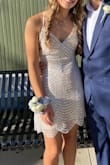 I looked at the size chart and decided I should order a small in this dress, but they accidentally sent me an XS. However, I am so thankful for this error bc the XS fit perfectly. The dress was comfortable and not itchy, and I got plenty of compliments. I think it would be best to size down since I ended up fitting a size smaller than expected. Honestly the small would have been to big. I would recommend! - Anna G.