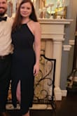 This dress is very pretty. I wore it to a wedding and it was great for dancing the night away. It is tighter than expected in the belly area, though. The picture on the site makes it look like it's loose fit under the cinching but it is form fitting under the bust. I would have gone with a medium if available because the small was a touch tight. It is very flattering though! - Amber H.
