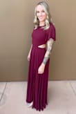 Love love love! Leaves just enough gap in the back to be sexy and show some skin yet be appropriate for a bridesmaids dress. The fabric has a nice weight to it and the slit is the perfect height. I'm tall and this dress was long on me but fit with heals. If your shorter than 5'8 you will definitely need it altered. - Sierra R.