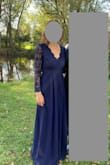 This is a beautiful dress. Size small fit perfectly on me. I wore 2 inch heels and needed to hem just about 1/2" from the bottom. Be warned - my back did get cold when sitting down and first touching a chair with my bare back, but I do get cold easily. Also, a slight snag may have developed in the skirt during the course of the evening so do handle with care. - Amy S.