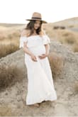 This dress is such a dream. I ordered a size medium and it fit perfectly with my 20 week baby bump. - Nancy G.