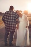 I bought a XL in this dress for my engagement photos and it did not disappoint! I was really impressed for the price I paid for it! It was a little tight on my arms but everything else was perfect! The slit was very modest and not to revealing!  The material is made well! It's heavy and doesn't feel cheap! - Jessica H.