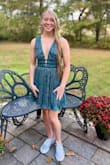 I stepped out of my comfort zone in this dress but since my bust is small it covered everything.  The color is beautiful!  I got so many compliments!  I ordered an XS but had to send it back for a Small.  I used double sided tape to make sure it would not open.  Very comfortable and great quality.  OH, shipping was very fast and returns were a breeze! - Macy M.