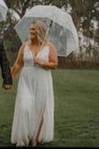 I ordered this dress on a whim! We planned our wedding in a week! I paid for expedited shipping to have it here ASAP! It showed up in 3 days! I read other reviews that said it runs large, so I decided to order an XL and it for perfectly! Still a smidge big, but not loose! And the adjustable straps are a major plus! I got so many compliments on this dress! The material is such good quality! So so pleased with this purchase! - Ashley F.