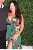So I bought like 3 different sizes based on reviews. Normally I wear Medium to Large because I have broad shoulders but I most definitely needed the Small, which is what I ended up with. It runs large so drop down a size. And the dress is super long unless you really want to wear a 4-5inch heel and still walk on it. I got my altered, brought the slit up like 3 inches and had the bottom hemmed. It was perfect! I had so many compliments and it was great for a fall wedding. - Jillian M.