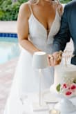 This dress exceeded my expectations! It is beautiful. It fit perfectly with no alterations (I am 5'9" and wore with no heels) The Pearl detailing and glittery tulle is amazing (even though it leaves glitter everywhere). This definitely could pass as a $1,000+ dress. - Courtney B.