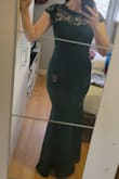 The fit is very snug (borderline tight) ontop and form fitting (with a bit of stretch) on bottom. The fabric is very thick (perfect for winter weddings or cold events) and will keep you warm. A word of warning: the zipper is incredibly finicky, to the point where I thought the dress might have been too small because we couldn't get it to budge. The length was a few inches too long, but wearing a 3.75in heel made it perfect. - Nicole K.