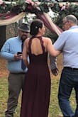 I actually wore this dress as my wedding dress. I didn't want to go the traditional white route as most brides do and I thought burgundy would be just right for my fall wedding. The dress is simple yet elegant with just the right amount of lace up top and the open back is a very nice detail. The dress runs true to size but it is very long so either wear heals or have it hemmed or you will be tripping over it. All in all a very gorgeous dress! - Nicole B.