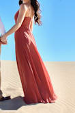 I bought this dress for my engagement pictures and omg it's amazing. There's so much extra material that it's so flowy! It's also pretty comfortable which is a plus and the color is amazing. - Hope R.