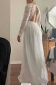 Loved the way the top fit and accented my back. Skirt is fine, but would love if there were more lace. Skirt was good length, won't need to shorten it at all. 

The skirt fits a little loose, but top fits great. Dress is very white, I tend to love ivory/off white dresses, but the fit was so great I'm still definitely considering this dress. - Megan J.