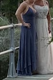 Loved this dress! Fit perfectly!  Has adjustable straps and the strings in the back can be tightened or loosened.  It was a little long though. - Jacqueline A.