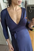 Deep plunge in front but nothing a pin can't fix if you don't want to show cleavage. High slit but only if you move in a certain way. Lots of fabric so covers you up. WAY LONG for my 5'2' shorty self but I'm having it hemmed it's too beautiful to send back. Fabric is soft and a little on the thin side, not see through but you may see panty lines or bra lines...spanx would help I guess. - Jahaira L.