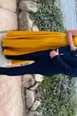 I bought the medium and the large since I've been losing weight. I was shocked that the medium fit perfectly! I had to have 3 inches hemmed off the bottom because it's really long. Then it fit with heels and was a little past floor length barefoot. I got so many compliments on the color! - Jenna R.