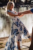 This dress is very light & flowy - perfect for summer! I wore it for my engagement photos and it was great with the exception of the cleavage area being a little large. I would not have gotten a different size but in some poses my bra was exposed. - Kimberly S.