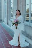Absolutely love this dress! Wore it for my elopement & it fit perfectly. I'm 4'11, 165, 36C & ordered a XL. I did not hem the dress. It was very long but I treated the extra length as a train. The slit in the dress helped pull the train look off. - Kori B.