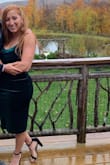 Material is stretchy but it's made to be a tight fit, so I'd say true to size - some areas felt a little sheer, so if you were between sizes, would size up. Overall loved the color / material / fit, got a ton of compliments, would buy again! - Amanda T.
