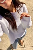 This is a cozy-chic staple!
Cropped, but not extremely so - Perfect with super high waisted denim or leggings (unless you're wanting to show skin).

Super soft and cozy, reminds me of the amazing quality of vintage cotton sweaters.

Sleeves run a bit long due to the awesome thumb holes (which somehow I missed but was a happy surprise) easy to roll/cuff for a more polished look. - Ashley M.