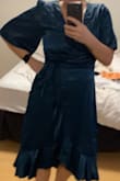 This dress looked NOTHING like the photos. I read every review and the quality looked beautiful. What I received was an overpriced matronly dress that was made of a cheap scratchy material. I think as a Canadian, this was my last shot with Lulus. :( - Brittani D.